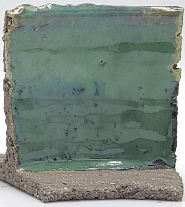 White Engobe + Black Engobe + Prisma Green on SIO2 Barcino Grey cone 6 oxidation