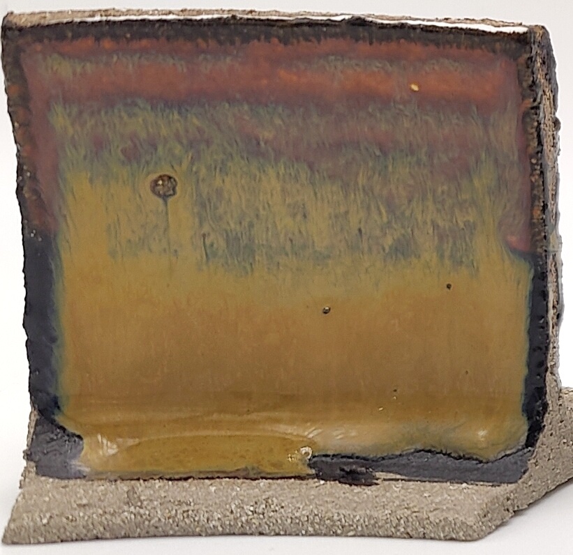 White Engobe + Black Engobe + Tiger's Eye on SIO2 Zumaia Grey (Rokk Grey) cone 6 oxidation