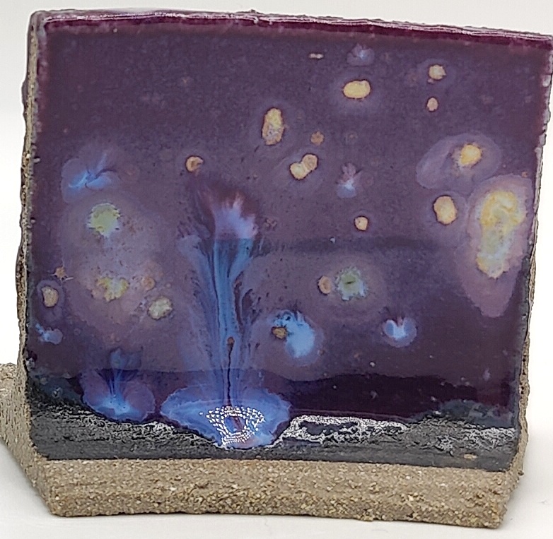 White Engobe + Black Engobe + Passion Flower on SIO2 Zumaia Grey (Rokk Grey) cone 6 oxidation
