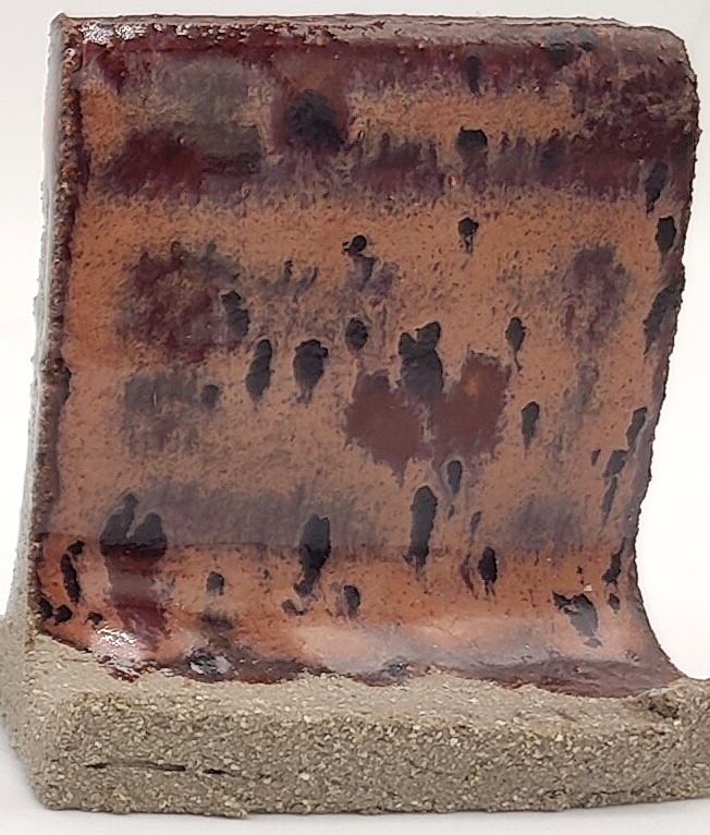 Peppered Plum on SIO2 Zumaia Grey (Rokk Grey) cone 6 oxidation