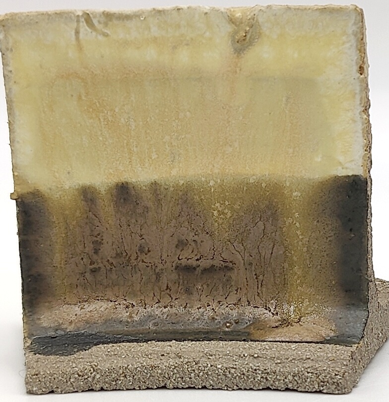 White Engobe + Black Engobe + Fossil Rock on SIO2 Zumaia Grey (Rokk Grey) cone 6 oxidation