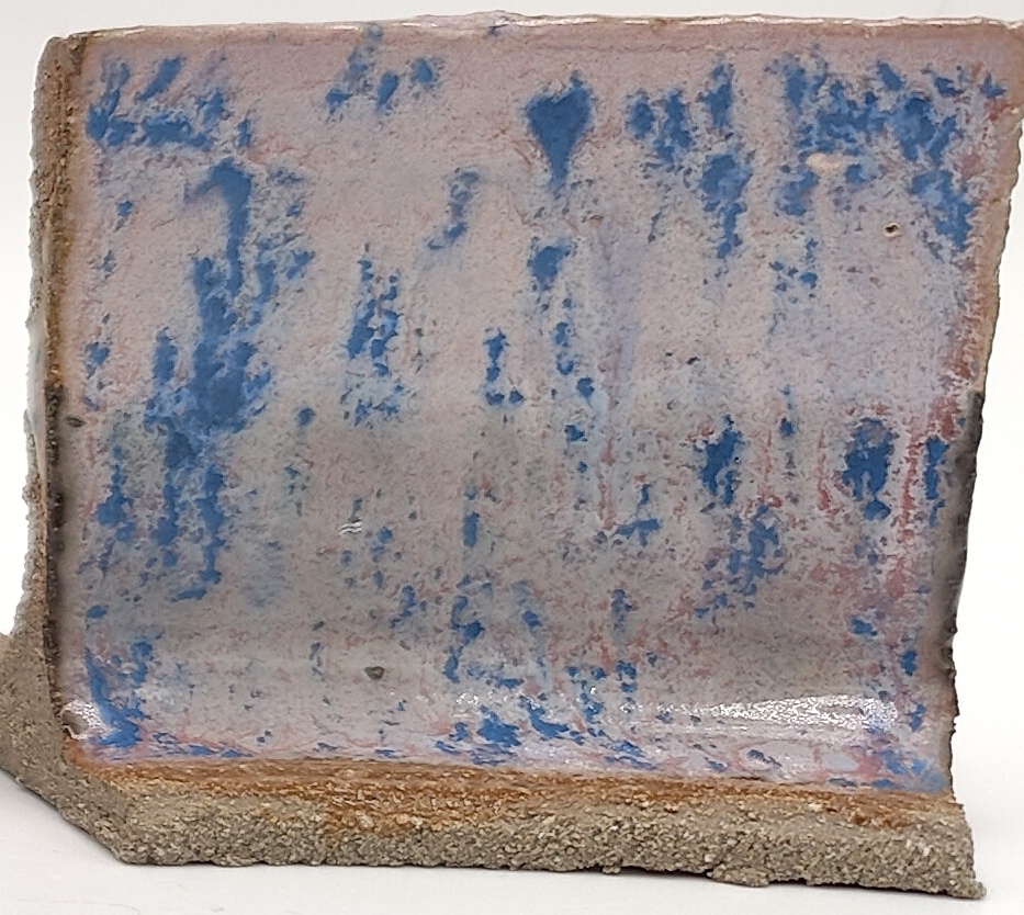 White Engobe + Black Engobe + Purple Aster on SIO2 Zumaia Grey (Rokk Grey) cone 6 oxidation