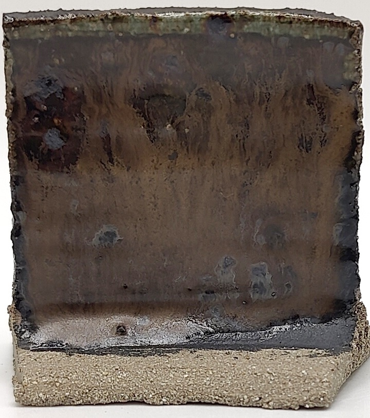 White Engobe + Black Engobe + Black Timber on SIO2 Zumaia Grey (Rokk Grey) cone 6 oxidation