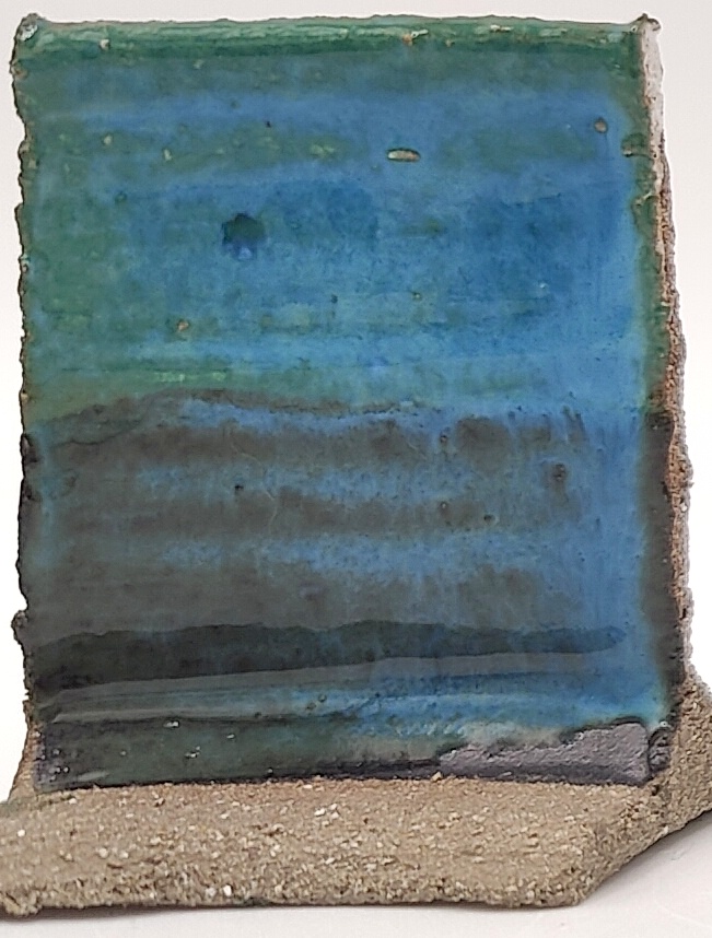 White Engobe + Black Engobe + Tropical Teal on SIO2 Zumaia Grey (Rokk Grey) cone 6 oxidation